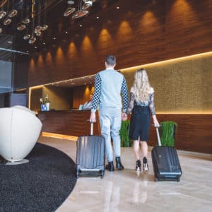 Happy couple starting their honeymoon at the luxurious hotel, lighting used to create a luxurious ambience throughout the airport.