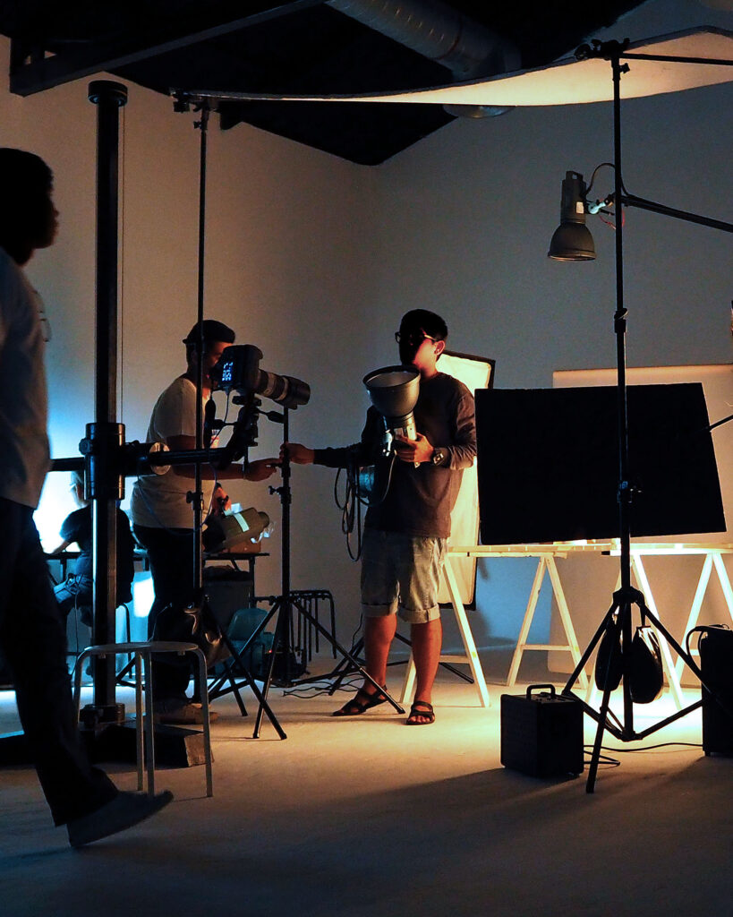 Production team shooting some video movie for tv commercial with studio equipment set.