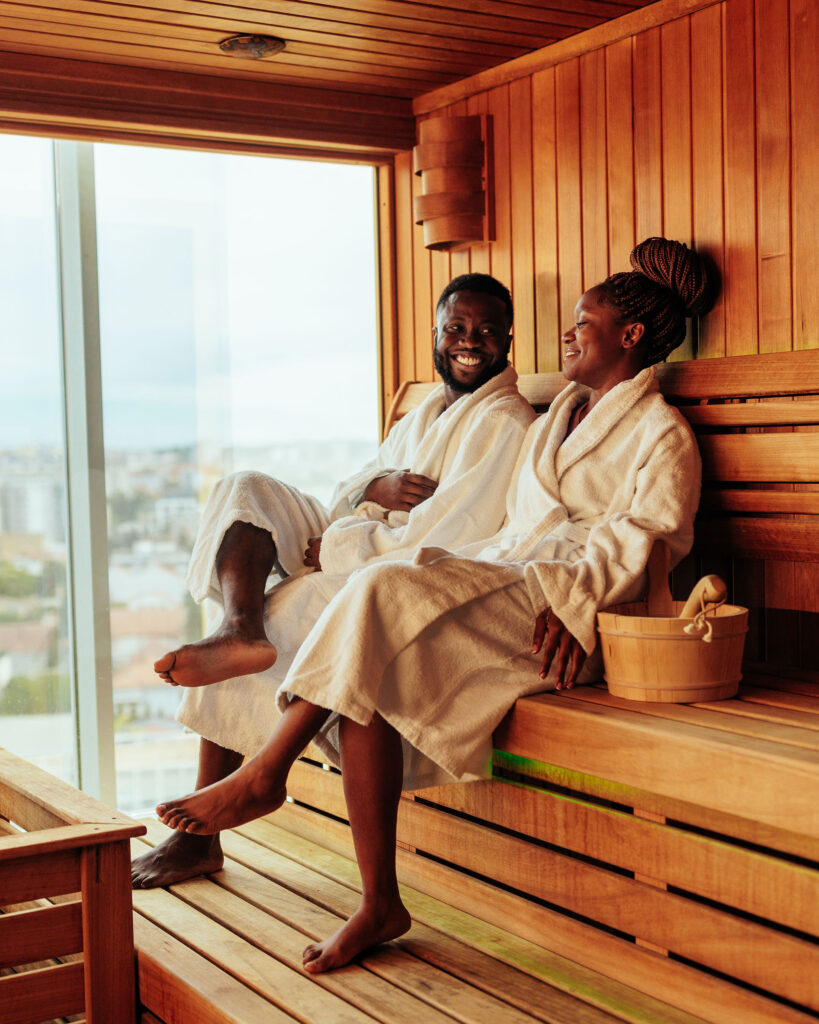 Two people enjoying a spa with audio speakers present.